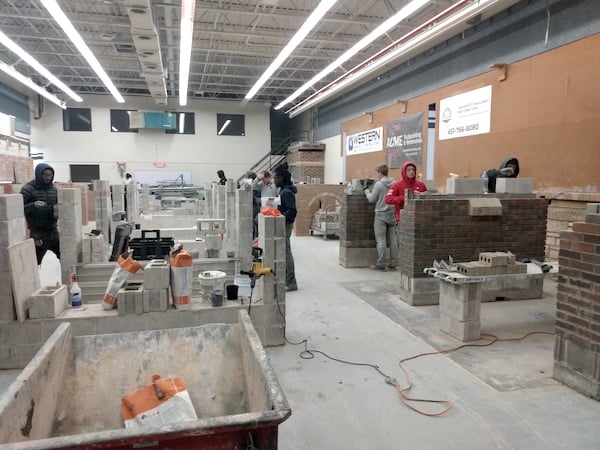 Training facilaties showing students working on brick laying projects