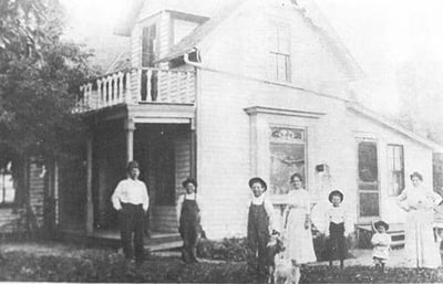 Carl Laumer Family House with family standing in front