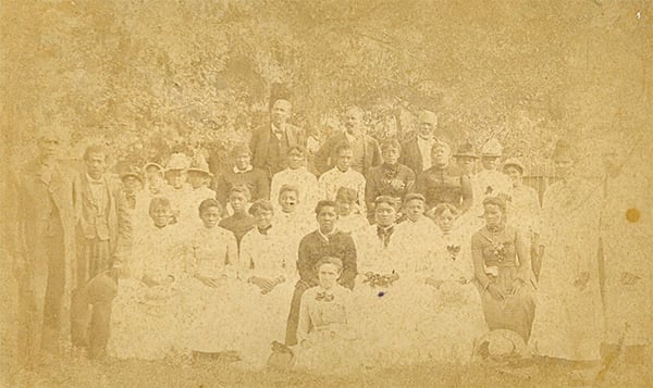 31 people standing and sitting for group photo at the Juneteenth Celebration at Emancipation_Park, ca.1880-photo is badly deteriorated