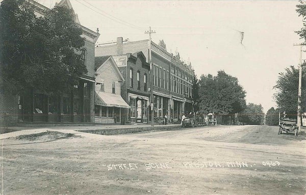 Fillmore Street scene showing commerical buildings and horse drew carts in Preston Minnesota ca. 1890