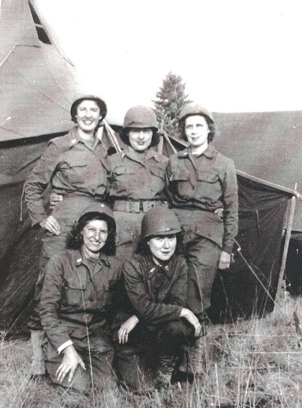 Five women in army uniforms posing together for camera. ca.1940s-50s
