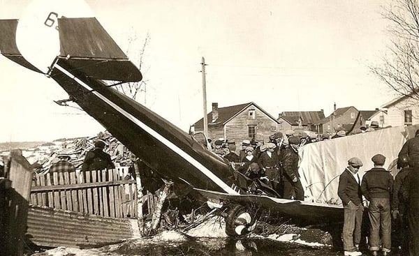 Crashed Plane with spectators standing around it