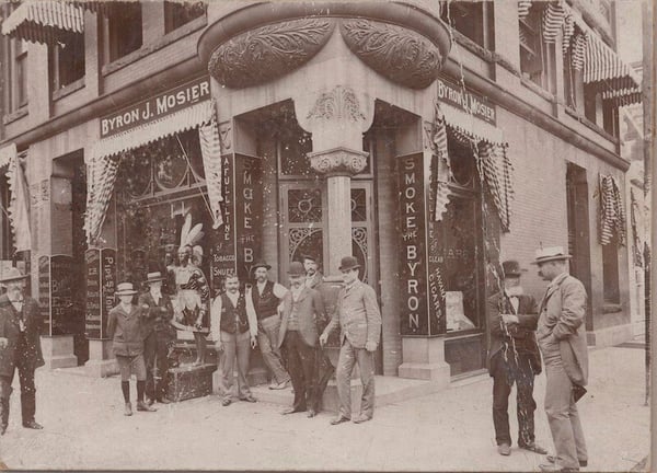 10 men standing in front of and around the Byron J. Mosier tobacco store in Stillwater ca. 1895