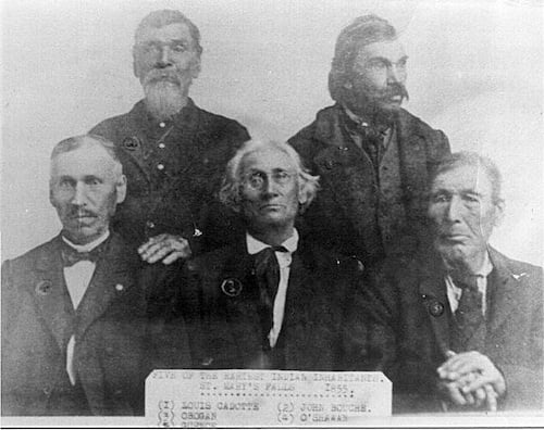 Five men siting for portrait including John Boucher. On the photo is a label titled - FIVE OF THE EARLEST INDIAN INHABITANTS OF ST. MARYS FALLS 1855.