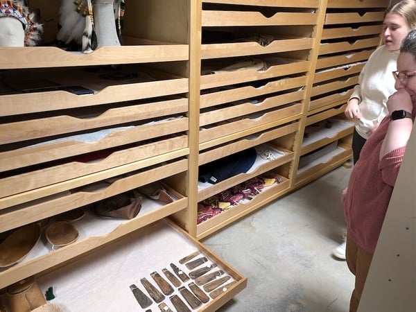 Looking at artifacts in collection drawers