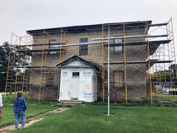 Exterior of the Wasioja School, surrounding by scaffolding