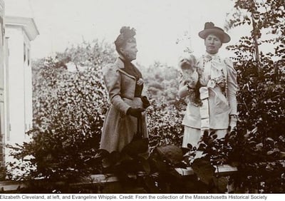 Rose-Cleveland-and-Evangeline-Whipple in garden Whipple is holding small dog