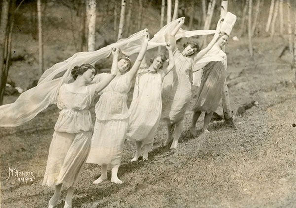 Line of students in costume dancing at May Fete