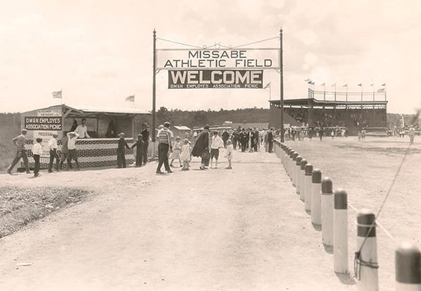 Baseball Ballpark field, Entrance sign says-Missabe Athletic Field, under it is banner WELCOME DMandN EMPLOYEES ASSOCIATION PICNIC