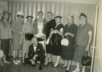 Black and white photograph of a Farm Bureau men in fashion show, 1962.