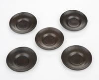 Tea-cup saucers for a doll