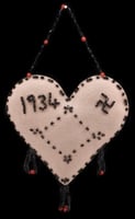 Color image of a Dakota pincushion from the Dakota community at Prairie Island in Goodhue County, c.1930s.