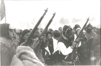 Gun salute during the twenty-fifth anniversary of the Wounded Knee occupation