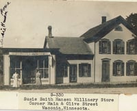 Black and white photograph of Susie Schmitt Hanson's  millinery store, on the corner Main and Olive in Waconia.
