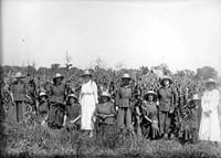 Incarcerated women posing by a cornfield