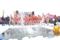 Hardy souls participating in the annual polar plunge event, International Eelpout Festival, ca. 2010s. Photo by Josh Stokes.