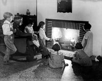 Black and white photograph of Dr. Henry Longstreet Taylor entertaining children at the Ramsey County Preventorium, c.1930.