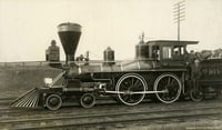 Black and white photograph of James J. Hill with two engineers on the William Crooks train engine, 1908. Photograph by T.W. Ingersoll.