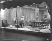Black and white photograph of furniture window display, c.1920.