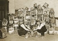 Black and white photograph of a police raid on slot machines, St. Paul, 1935. Photograph from the St. Paul Daily News.