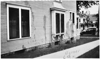 Black and white photograph of Frederick A. Scherf's home splattered with paint.