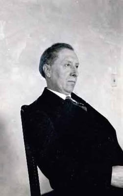Black and white photograph of Joseph Gilbert seated, c.1925.