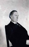 Black and white photograph of Joseph Gilbert seated, c.1925.