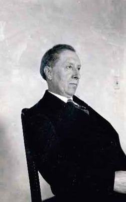 Black and white photograph of Joseph Gilbert seated, c.1925.