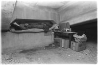 Two people without housing sleeping under an I-94 overpass