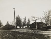 Black and white photograph of two of the mounds, with walking path, at Indian Mounds Park, ca. 1900.