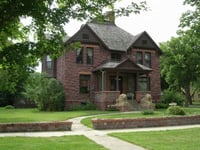 Color image of the Hinkly House, built in 1892 by R. B. Hinkly using Sioux quartzite mined from a quarry where the Blue Mounds State Park is located, 2007.
