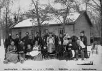 Black and white photograph of Crescent Grange Hall and members, Linwood Township, Anoka County, 1880.