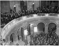 Black and white photograph of thousands of farmers gathering at the Minnesota State Capitol to hear Governor Floyd B. Olson talk on farm relief, ca. 1935.