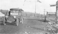 Black and white photograph of Red Cross Motor Service car providing relief efforts after the October fires of 1918.