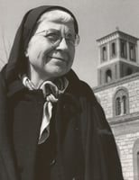 Black and white photograph of Alice Gustava Smith (Sister Maris Stella) at Our Lady of Victory Chapel on the campus of the College of St. Catherine, c.1970.