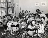 Black and white publicity photograph (taken c.1930) showing arts and crafts activates for kids enrolled at Stay at Home Camp, a summer camp developed by the Jewish Center Activities Association, for the growing number of families joining the J. E. C.
