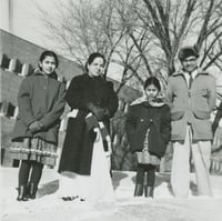 Black and white photograph of Dr. Padmakar K. Dixit, his wife, and their two daughters in Minnesota, 1962.
