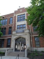 Color image of the front entrance of Cleveland Junior High School (now Farnsworth Aerospace Pre-K-8 School) in St. Paul designed by Clarence Wigington and built in 1924. Photographed by Paul Nelson on August 15, 2014.