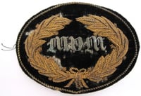 United States Army General and Staff officers hat insignia worn during the Civil War by General John B. Sanborn of the 4th Minnesota Regiment. The velvet patch is embroidered in bullion with a wreath and the letters MVM (Minnesota Volunteer Militia).