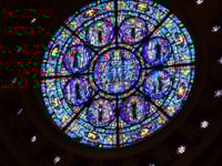 Color image of a north-facing, stained-glass rose window of the St. Paul Cathedral. Photographed by Paul Nelson on July 10, 2014.