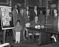 Harold LeVander signing a proclamation
