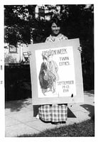 Photograph of Wanda Gág with a poster she submitted in a contest, 1914.