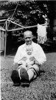 Black and white photograph of Delos Lovelace with his daughter, Merion, c.1931.