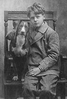 Black and white photograph of Charles Lindbergh with his dog Dingo, c.1912.