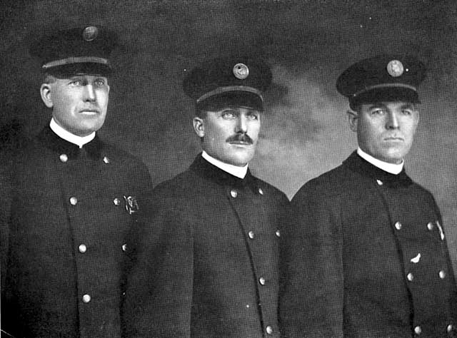 Duluth policemen, group photo. Edward H. Barber, Police Lieutenant, at far right.