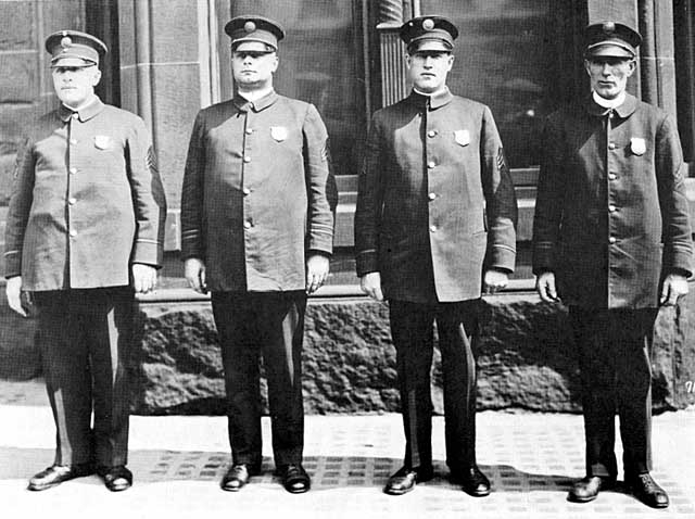 Duluth policemen, group photo. Oscar G. Olson (August 9, 1887 - December 1, 1941), Police Lieutenant, second from left.