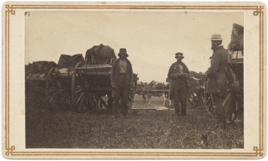 Black and white photograph of a camp with Red River carts, ca. 1860.