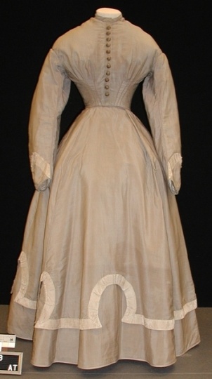 Color image of a wool wedding dress and jacket worn by Mary T. Hill, 1867.