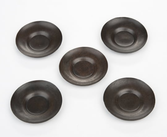 Tea-cup saucers for a doll