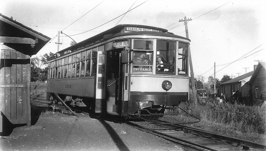 photograph of a streetcar at a station